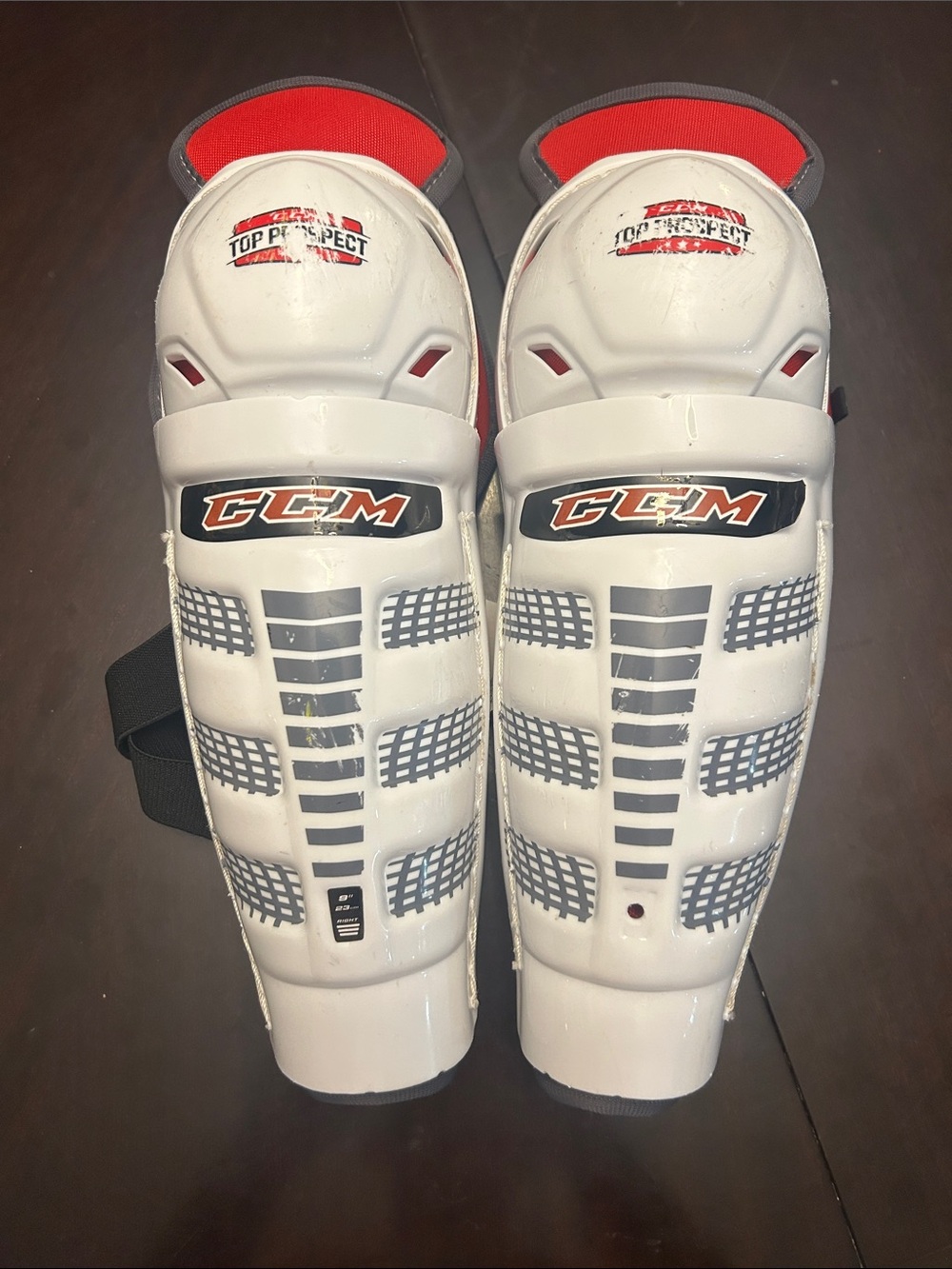 CCM White and Red Youth Hockey Shin Guards